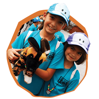 Kids at el paso zoo camp, girl holding stuffed toy dog